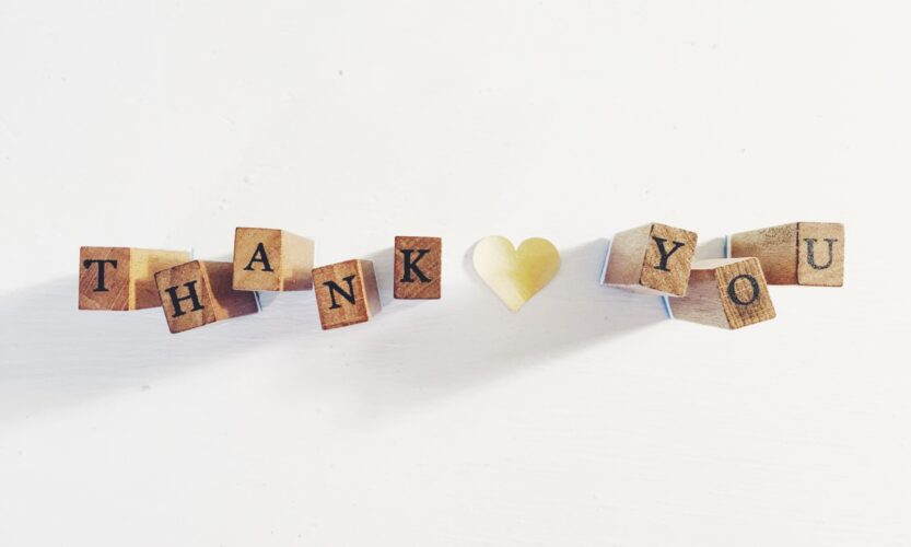 Thank you spelled out in wooden blocks
